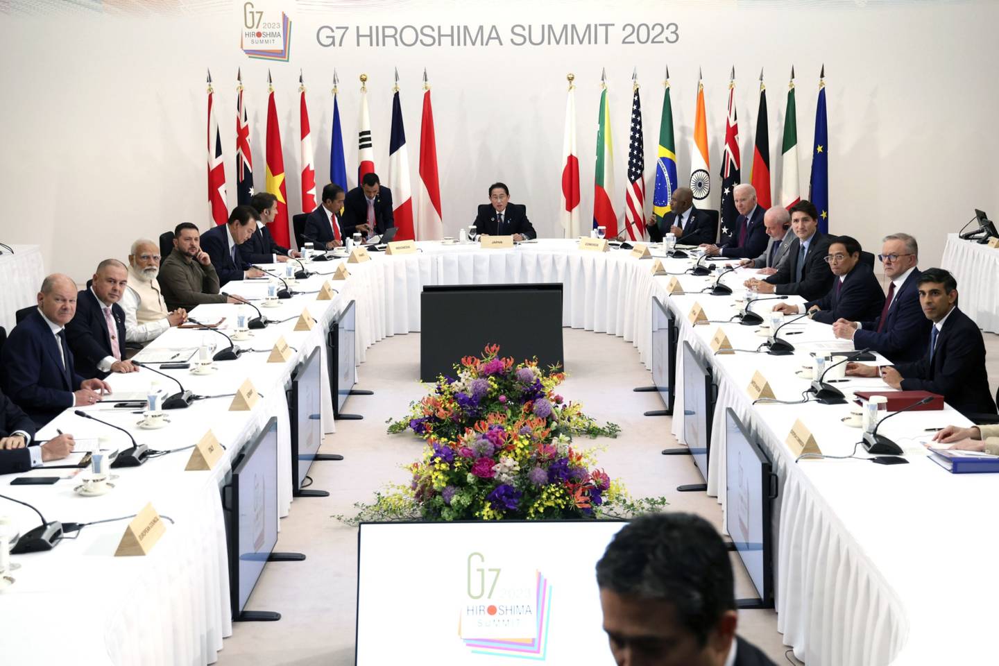Volodymyr Zelenskiy, Ukraine's president, fourth from left, sits with the Group of Seven (G-7) leaders and outreach countries prior to a session during the G-7 leaders summit in Hiroshima, Japan.