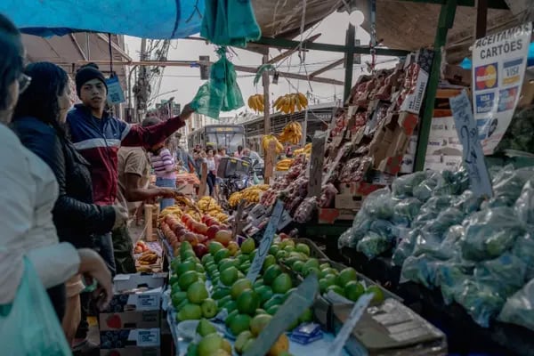 Shoppers purchase produce at the Madureira Market in the Madureira neighborhood of Rio de Janeiro, Brazil, on Wednesday, Aug. 10, 2022. Soaring prices of food and fuel across Latin America are hitting the poor the hardest, creating a political tinderbox thats a warning to the world.