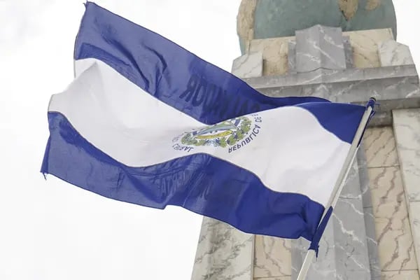 A demonstrator waves the El Salvador flag during a protest ahead of a state of the union address by Nayib Bukele, El Salvador's president, at Salvador del Mundo plaza in San Salvador, El Salvador, on Wednesday, June 1, 2022. The crypto-touting Central American nation of El Salvador is getting thrashed in the bond market as an $800 million obligation falls to record lows. Photographer: Camilo Freedman/Bloomberg