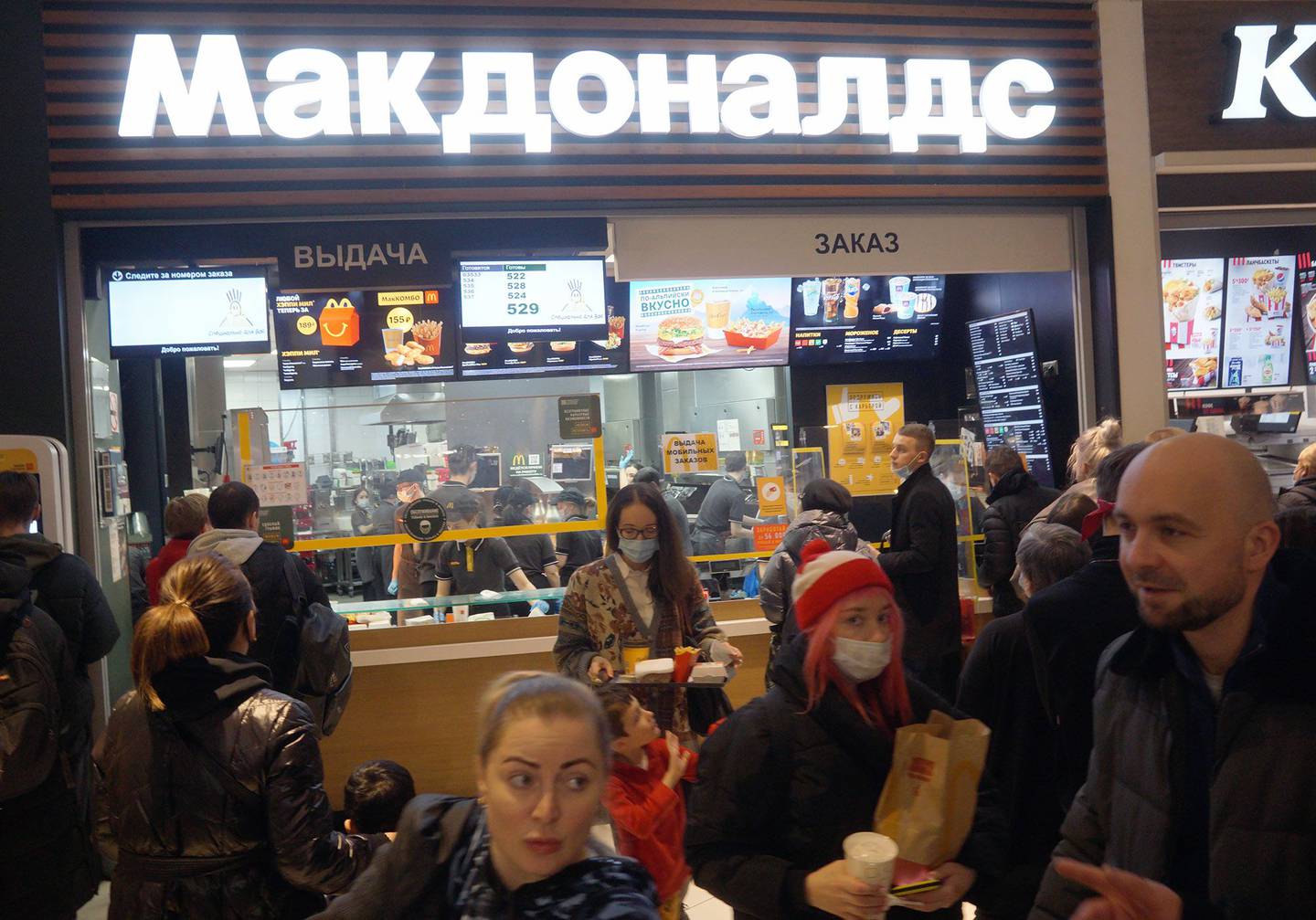 People visit a McDonald's before it closes at the end of the week, in Moscow, on March 9.