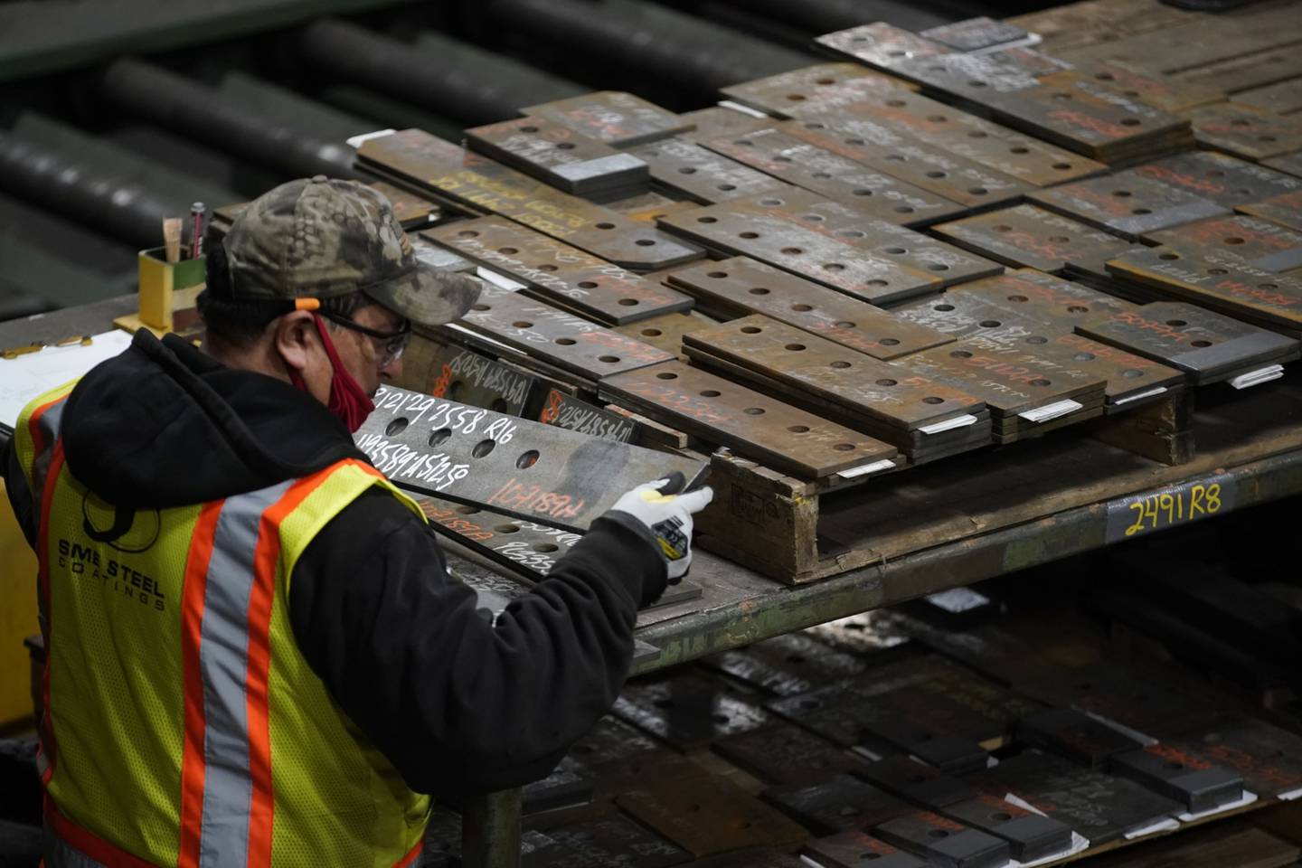 A worker gathers parts during production at the SME Steel Contractors facility in West Jordan, Utah, U.S., on Feb. 1, 2021. Markit is scheduled to release manufacturing figures on February 3. Photographer: George Frey/Bloomberg