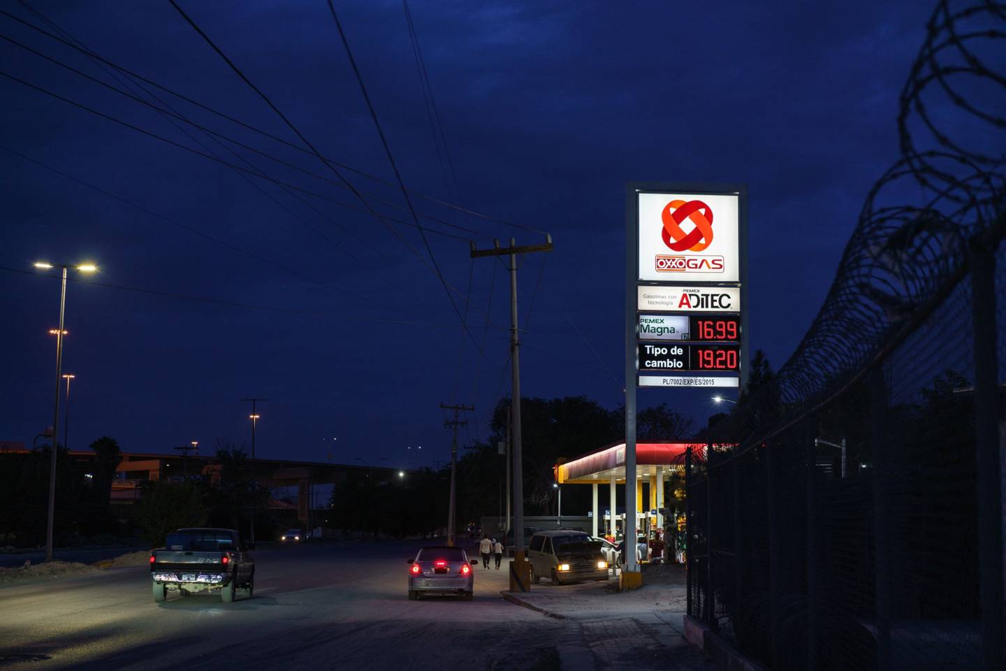 An Oxxo gas station is pictured at night in Ciudad Jurez, Chihuahua State, Mexico on Thursday, July 21, 2022. As high gas prices in the United States have persisted, lower Mexican gas prices attract cross border customers due to a subsidy given by the Mexican government.dfd