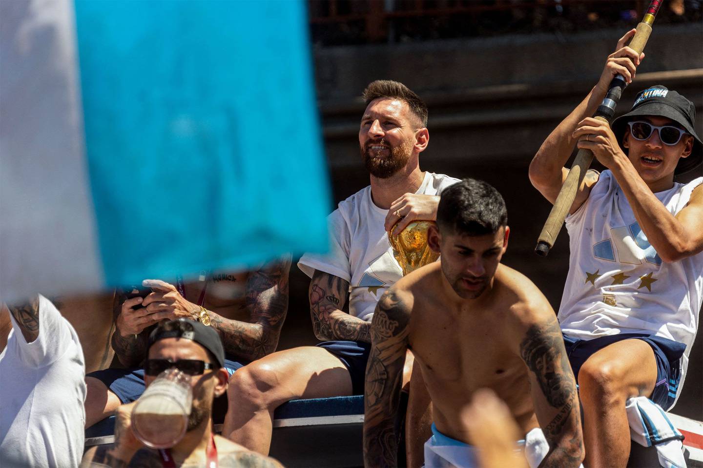 Lionel Messi rides an open bus during their homecoming parade in Buenos Aires, Argentina, on Tuesday, Dec. 20, 2022.