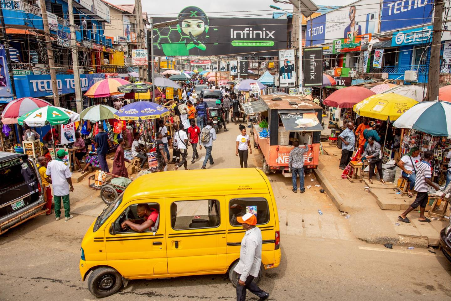 A taxi van drives past the entrance to the Ikeja computer village market in Lagos, Nigeria, on Monday, March 29, 2021.