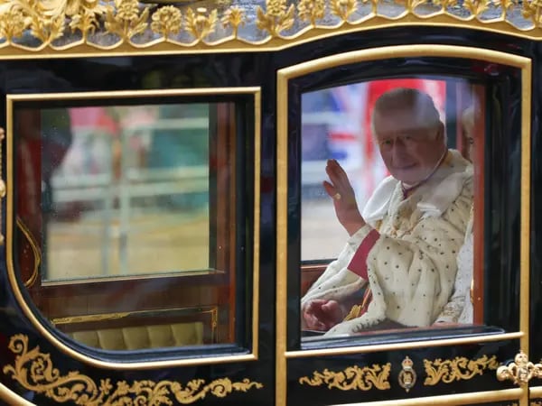 King Charles III, left, and Queen Camilla, travel in the Diamond Jubilee carriage, on the day of the coronation of King Charles III, in London, UK, on Saturday, May 6, 2023. The event is expected to put enduring British soft power on display as some 2,000 dignitaries, spiritual leaders and celebrities watch on, with thousands gathering on Londons streets and millions more tuning in from around the globe. Photographer: Hollie Adams/Bloomberg