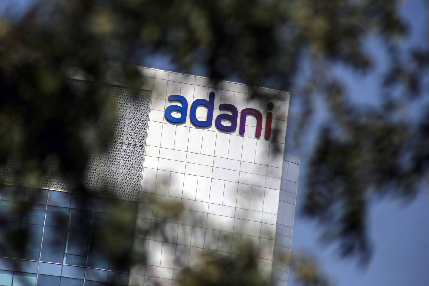 Signage atop the Adani Group headquarters in Ahmedabad, India. Photographer: Dhiraj Singh/Bloomberg