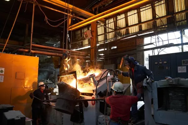 Employees remove molten steel at the Ramsa manufacturing facility in San Luis Potosi, Mexico.