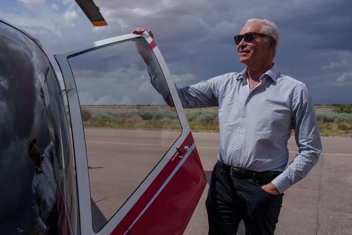 Alan Russel, chairman and CEO of TECMA, poses for a portrait next to his helicopter at the Dona Ana County International Jetport in Santa Teresa, New Mexico on Tuesday, August 9, 2022.dfd