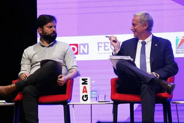 Chilean presidential candidates Jose Antonio Kast and Gabriel Boric attend a radio debate at Gabriela Mistral cultural center in Santiago on Nov. 2, 2021.