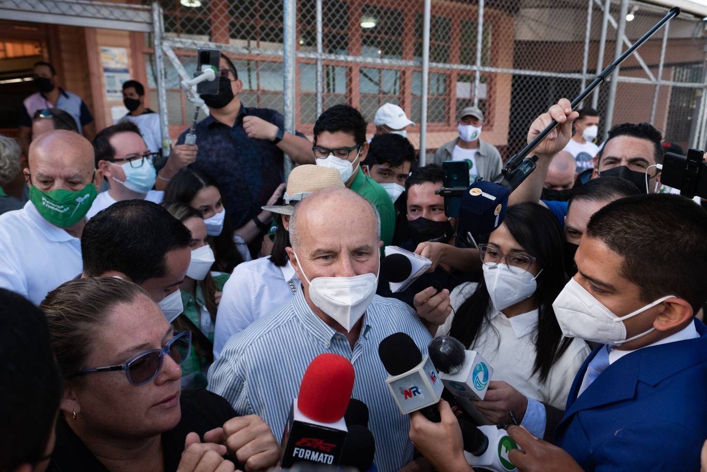 Jose Maria Figueres, presidential candidate of the National Liberation Party, center, speaks to members of the media after casting a ballot at a polling station during presidential elections in San Jose, Costa Rica.