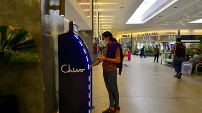A customer uses a Chivo Bitcoin automated teller machine (ATM) at the Cascadas shopping mall in San Salvador, El Salvador.