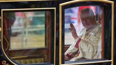 King Charles III, left, and Queen Camilla, travel in the Diamond Jubilee carriage, on the day of the coronation of King Charles III, in London, UK, on Saturday, May 6, 2023. The event is expected to put enduring British soft power on display as some 2,000 dignitaries, spiritual leaders and celebrities watch on, with thousands gathering on Londons streets and millions more tuning in from around the globe. Photographer: Hollie Adams/Bloomberg