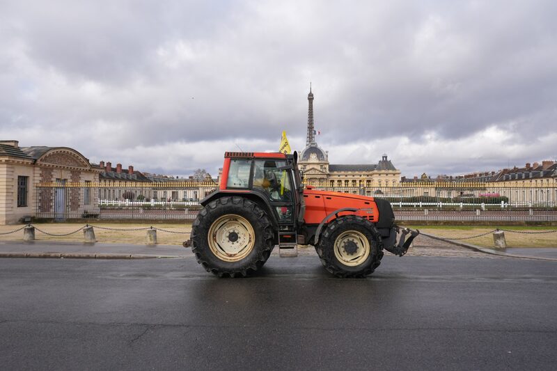 A French farmer drives a tractor towards Les Invalides during a protest in central Paris, France, on Friday, Feb. 23. 2024. Farmers in France, like in large parts of Europe, have been protesting against falling prices for their products and increasing climate-linked norms imposed on them by the European Union, which they claim is eroding their competitiveness in global markets. Photographer: Nathan Laine/Bloomberg A French farmer drives a tractor towards Les Invalides during a protest in central Paris, France, on Friday, Feb. 23. 2024. Farmers in France, like in large parts of Europe, have been protesting against falling prices for their products and increasing climate-linked norms imposed on them by the European Union, which they claim is eroding their competitiveness in global markets. Photographer: Nathan Laine/Bloomberg