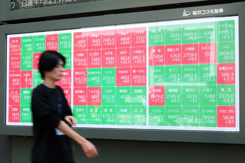 A screen displays share prices outside a securities firm in Tokyo, Japan, on Wednesday, July 22, 2026. The yen slid past 163 per dollar overnight for the first time since 1986 after renewed tensions in the US-Iran conflict pushed oil prices higher. Photographer: Kiyoshi Ota/Bloomberg A screen displays share prices outside a securities firm in Tokyo, Japan, on Wednesday, July 22, 2026. The yen slid past 163 per dollar overnight for the first time since 1986 after renewed tensions in the US-Iran conflict pushed oil prices higher. Photographer: Kiyoshi Ota/Bloomberg