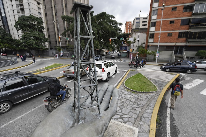A sculpture of a hand holding an oil well outside Petroleos de Venezuela SA (PDVSA) headquarters in Caracas, Venezuela, on Thursday, Dec. 1, 2022. The Biden administration granted Chevron Corp. a license to resume oil production in Venezuela after US sanctions halted all drilling activities almost three years ago. Photographer: Matias Delacroix/Bloomberg A sculpture of a hand holding an oil well outside Petroleos de Venezuela SA (PDVSA) headquarters in Caracas, Venezuela, on Thursday, Dec. 1, 2022. The Biden administration granted Chevron Corp. a license to resume oil production in Venezuela after US sanctions halted all drilling activities almost three years ago. Photographer: Matias Delacroix/Bloomberg