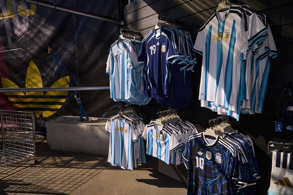 Argentina team jerseys for sale at a FIFA World Cup 2026 watch party hosted by Adidas at Brooklyn Bridge Park in the Brooklyn borough of New York, US, on Tuesday, June 16, 2026. The World Cup is back in the US for the first time since 1994 in its biggest version yet, encompassing 48 teams and 104 matches that are also being played in neighboring Canada and Mexico. Photographer: Bing Guan/Bloomberg Argentina team jerseys for sale at a FIFA World Cup 2026 watch party hosted by Adidas at Brooklyn Bridge Park in the Brooklyn borough of New York, US, on Tuesday, June 16, 2026. The World Cup is back in the US for the first time since 1994 in its biggest version yet, encompassing 48 teams and 104 matches that are also being played in neighboring Canada and Mexico. Photographer: Bing Guan/Bloomberg