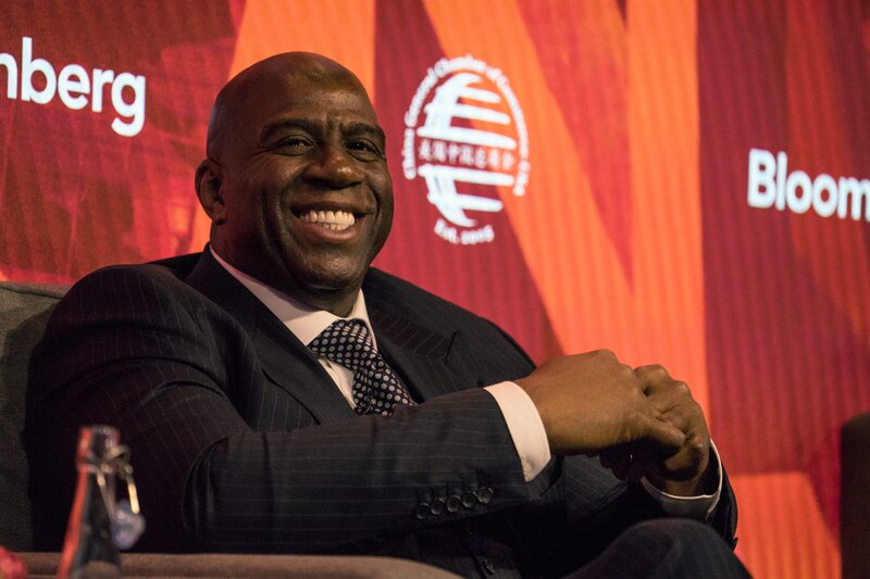 Earvin "Magic" Johnson, chairman and chief operating officer of Magic Johnson Enterprises Inc., smiles during the 2017 International Finance and Infrastructure Cooperation Forum in New York, U.S., on Monday, April 24, 2017. The forum brings together U.S. and Chinese government officials and global business executives from Fortune 500 companies. Photographer: Misha Friedman/Bloomberg Earvin "Magic" Johnson, chairman and chief operating officer of Magic Johnson Enterprises Inc., smiles during the 2017 International Finance and Infrastructure Cooperation Forum in New York, U.S., on Monday, April 24, 2017. The forum brings together U.S. and Chinese government officials and global business executives from Fortune 500 companies. Photographer: Misha Friedman/Bloomberg