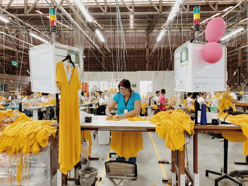 An employee sews dresses at the Guararapes Confeccoes SA textile factory in Natal, Rio Grande do Norte, Brazil. An employee sews dresses at the Guararapes Confeccoes SA textile factory in Natal, Rio Grande do Norte, Brazil.
