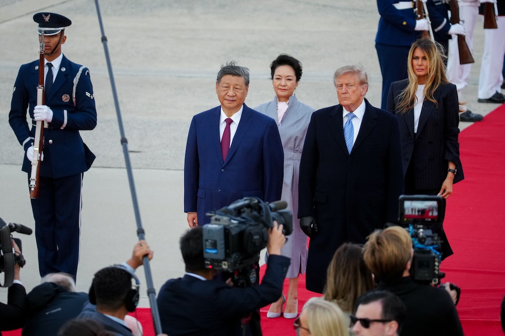 Xi Jinping, China's president, from left, Peng Liyuan, China's first lady, US President Donald Trump, and First Lady Melania Trump during an arrival ceremony at Joint Base Andrews, Maryland, US, on Wednesday, Sept. 23, 2026. Xi Jinping and Donald Trump will sit down this week to hash out a plethora of thorny issues from trade to Taiwan. One thing both sides agree on: neither can afford to tap the brakes on AI. Photographer: Al Drago/Bloomberg Xi Jinping, China's president, from left, Peng Liyuan, China's first lady, US President Donald Trump, and First Lady Melania Trump during an arrival ceremony at Joint Base Andrews, Maryland, US, on Wednesday, Sept. 23, 2026. Xi Jinping and Donald Trump will sit down this week to hash out a plethora of thorny issues from trade to Taiwan. One thing both sides agree on: neither can afford to tap the brakes on AI. Photographer: Al Drago/Bloomberg