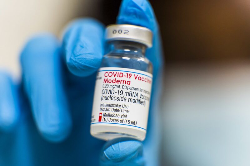A health worker holds a vial of the Moderna Inc. Covid-19 vaccine at the Banco Santander SA headquarters in Boadilla del Monte, Spain, on Tuesday, July 6, 2021. Santander signed a deal with the Madrid regional government for residents to get vaccinated at its HQ building outside the capital. Photographer: Angel Garcia/Bloomberg A health worker holds a vial of the Moderna Inc. Covid-19 vaccine at the Banco Santander SA headquarters in Boadilla del Monte, Spain, on Tuesday, July 6, 2021. Santander signed a deal with the Madrid regional government for residents to get vaccinated at its HQ building outside the capital. Photographer: Angel Garcia/Bloomberg