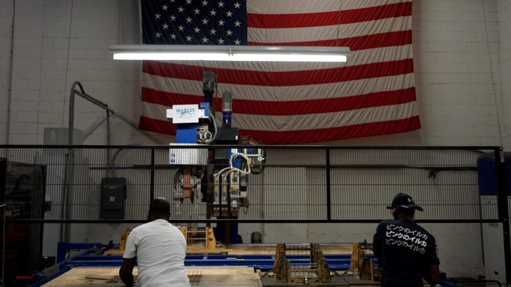 An American flag is displayed on the factory floor at Marlin Steel Wire Products LLC in Baltimore, Maryland, U.S., on Tuesday, Aug. 29, 2017. While economists have paid more attention to the opioid epidemic's role in keeping people out of work, about two-thirds of those who report misusing pain-relievers are on the payroll. Marlin Steel owner and president Drew Greenblatt says the labor squeeze plus the opioid crisis are making it especially hard to expand quickly when they get new orders. Photographer: Aaron P. Bernstein/Bloomberg via Getty Images An American flag is displayed on the factory floor at Marlin Steel Wire Products LLC in Baltimore, Maryland, U.S., on Tuesday, Aug. 29, 2017. While economists have paid more attention to the opioid epidemic's role in keeping people out of work, about two-thirds of those who report misusing pain-relievers are on the payroll. Marlin Steel owner and president Drew Greenblatt says the labor squeeze plus the opioid crisis are making it especially hard to expand quickly when they get new orders. Photographer: Aaron P. Bernstein/Bloomberg via Getty Images