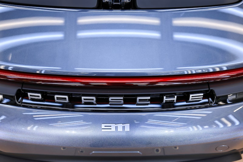 The rear of a Porsche 911 luxury sports car. The rear of a Porsche 911 luxury sports car.