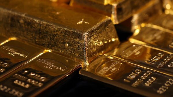 ¿Y si el oro reemplazara al dólar? VanEck estima cuánto debería valer en ese escenario ¿Y si el oro reemplazara al dólar? VanEck estima cuánto debería valer en ese escenario