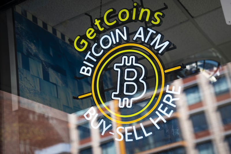 Bitcoin signage for an automated teller machine (ATM) at a gas station in Washington, D.C., U.S., on Monday, Feb. 28, 2022. Cryptocurrencies appear to be kicking off the week with a more positive outlook than U.S. stocks, just as some strategists are predicting the recent high correlation between the two may begin to ease. Photographer: Sarah Silbiger/Bloomberg Bitcoin signage for an automated teller machine (ATM) at a gas station in Washington, D.C., U.S., on Monday, Feb. 28, 2022. Cryptocurrencies appear to be kicking off the week with a more positive outlook than U.S. stocks, just as some strategists are predicting the recent high correlation between the two may begin to ease. Photographer: Sarah Silbiger/Bloomberg
