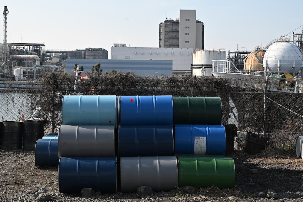 Oil storage drums stacked in the Keihin industrial area in Kawasaki, Japan, on Tuesday, March 24, 2026. Japanese Prime Minister Sanae Takaichi looked to ramp up the nations response to the fallout from the war in Iran with a thorough review of the ecosystem of oil-related products, as the likelihood builds of shortages and knock-on effects across the economy. Photographer: Soichiro Koriyama/Bloomberg Oil storage drums stacked in the Keihin industrial area in Kawasaki, Japan, on Tuesday, March 24, 2026. Japanese Prime Minister Sanae Takaichi looked to ramp up the nations response to the fallout from the war in Iran with a thorough review of the ecosystem of oil-related products, as the likelihood builds of shortages and knock-on effects across the economy. Photographer: Soichiro Koriyama/Bloomberg