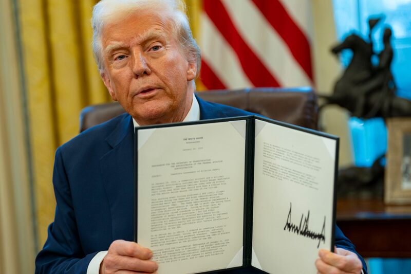 US President Donald Trump signs executive orders in the Oval Office of the White House in Washington, DC, US, on Thursday, Jan. 30, 2025. Trump signed an executive action he said directed federal agencies to undo diversity, equity and inclusion practices at the Department of Transportation and the Federal Aviation Administration that he has blamed as responsible for a deadly midair collision between a passenger jet and military helicopter at an airport near Washington. Photographer: Bonnie Cash/UPI/Bloomberg US President Donald Trump signs executive orders in the Oval Office of the White House in Washington, DC, US, on Thursday, Jan. 30, 2025. Trump signed an executive action he said directed federal agencies to undo diversity, equity and inclusion practices at the Department of Transportation and the Federal Aviation Administration that he has blamed as responsible for a deadly midair collision between a passenger jet and military helicopter at an airport near Washington. Photographer: Bonnie Cash/UPI/Bloomberg