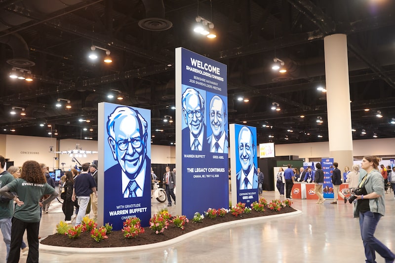 Signage depicting former Berkshire Hathaway CEO Warren Buffett and Berkshire Hathaway CEO Greg Abel inside the convention hall during a shareholders shopping day ahead of the Berkshire Hathaway annual shareholders meeting in Omaha, Nebraska, US, on Friday, May 1, 2026. CEO Greg Abel has pledged to follow Buffett's approach to investing and managing risk - Saturday's meeting is branded with the slogan "The Legacy Continues." Photographer: Dan Brouillette/Bloomberg Signage depicting former Berkshire Hathaway CEO Warren Buffett and Berkshire Hathaway CEO Greg Abel inside the convention hall during a shareholders shopping day ahead of the Berkshire Hathaway annual shareholders meeting in Omaha, Nebraska, US, on Friday, May 1, 2026. CEO Greg Abel has pledged to follow Buffett's approach to investing and managing risk - Saturday's meeting is branded with the slogan "The Legacy Continues." Photographer: Dan Brouillette/Bloomberg