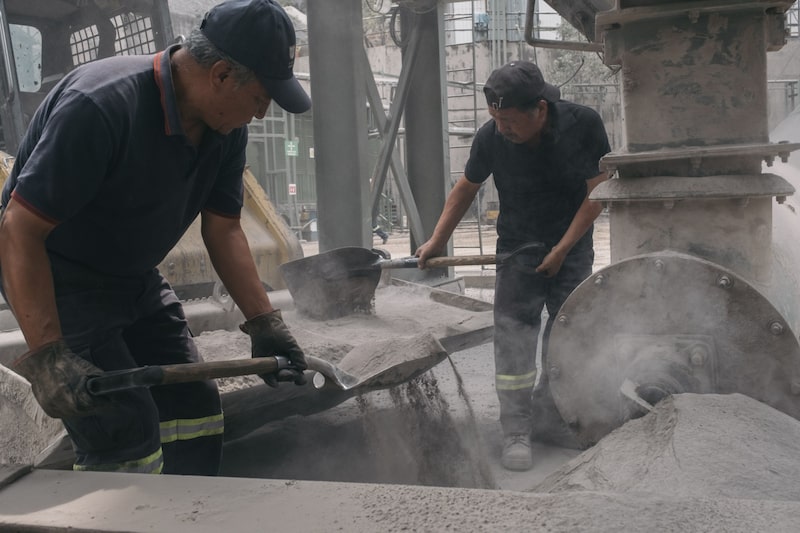 Workers shovel sand at an asphalt manufacturing facility in Mexico City, Mexico, on Friday, May 19, 2023. Mexico's local industrial production figures came in weaker-than-expected last week, possibly weighing on the nation's currency. Photographer: Jeoffrey Guillemard/Bloomberg Workers shovel sand at an asphalt manufacturing facility in Mexico City, Mexico, on Friday, May 19, 2023. Mexico's local industrial production figures came in weaker-than-expected last week, possibly weighing on the nation's currency. Photographer: Jeoffrey Guillemard/Bloomberg