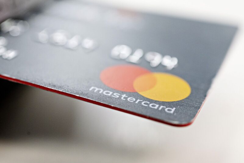 A Mastercard credit card is displayed for a photograph in Tiskilwa, Illinois, U.S., on Tuesday, Sept. 18, 2018. Visa Inc. and Mastercard Inc. agreed to pay as much as $6.2 billion to end a long-running price-fixing case brought by merchants over card fees, the largest-ever class action settlement of an antitrust case. Photographer: Daniel Acker/Bloomberg A Mastercard credit card is displayed for a photograph in Tiskilwa, Illinois, U.S., on Tuesday, Sept. 18, 2018. Visa Inc. and Mastercard Inc. agreed to pay as much as $6.2 billion to end a long-running price-fixing case brought by merchants over card fees, the largest-ever class action settlement of an antitrust case. Photographer: Daniel Acker/Bloomberg