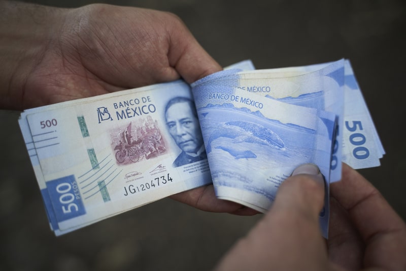 Mexican 500 peso banknotes arranged in Axtla de Terrazas, San Luis Potosi, Mexico, on Sunday, April 2, 2023. The Mexican peso is down 0.2% after inflation came in marginally below estimates, strengthening the view that the monetary tightening cycle may be over. Photographer: Mauricio Palos/Bloomberg Mexican 500 peso banknotes arranged in Axtla de Terrazas, San Luis Potosi, Mexico, on Sunday, April 2, 2023. The Mexican peso is down 0.2% after inflation came in marginally below estimates, strengthening the view that the monetary tightening cycle may be over. Photographer: Mauricio Palos/Bloomberg
