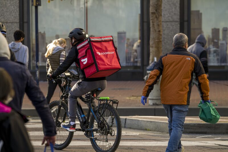 A bike messenger carries a DoorDash Inc. bag in San Francisco, California. A bike messenger carries a DoorDash Inc. bag in San Francisco, California.
