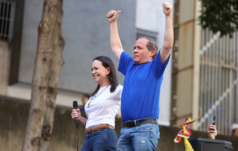 Former Deputy of the National Assembly of Venezuela, Juan Pablo Guanipa (R) gestures next to Venezuelan opposition leader Maria Corina Machado during a protest called by the opposition on the eve of the presidential inauguration in Caracas on January 9, 2025. Machado, who emerged from hiding to lead protests against the swearing-in of Nicolas Maduro for a highly controversial third term as president, was arrested after being "violently intercepted upon exiting the rally," according to her security team. (Photo by Pedro MATTEY / AFP) (Photo by PEDRO MATTEY/AFP via Getty Images) Former Deputy of the National Assembly of Venezuela, Juan Pablo Guanipa (R) gestures next to Venezuelan opposition leader Maria Corina Machado during a protest called by the opposition on the eve of the presidential inauguration in Caracas on January 9, 2025. Machado, who emerged from hiding to lead protests against the swearing-in of Nicolas Maduro for a highly controversial third term as president, was arrested after being "violently intercepted upon exiting the rally," according to her security team. (Photo by Pedro MATTEY / AFP) (Photo by PEDRO MATTEY/AFP via Getty Images)