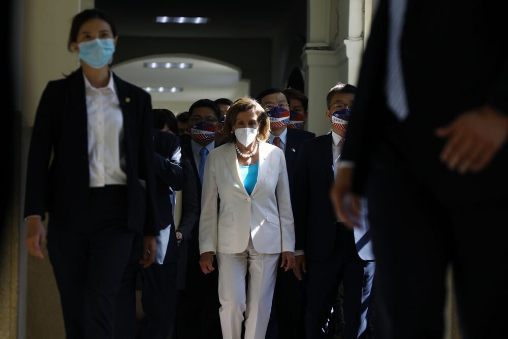 US House Speaker Nancy Pelosi, center, arrives at the Legislative Yuan in Taipei, Taiwan, on Wednesday, Aug. 3, 2022. Pelosi became the highest-ranking American politician to visit Taiwan in 25 years, prompting China to announce missile tests and military drills encircling the island that set the stage for some of its most provocative actions in decades. US House Speaker Nancy Pelosi, center, arrives at the Legislative Yuan in Taipei, Taiwan, on Wednesday, Aug. 3, 2022. Pelosi became the highest-ranking American politician to visit Taiwan in 25 years, prompting China to announce missile tests and military drills encircling the island that set the stage for some of its most provocative actions in decades.