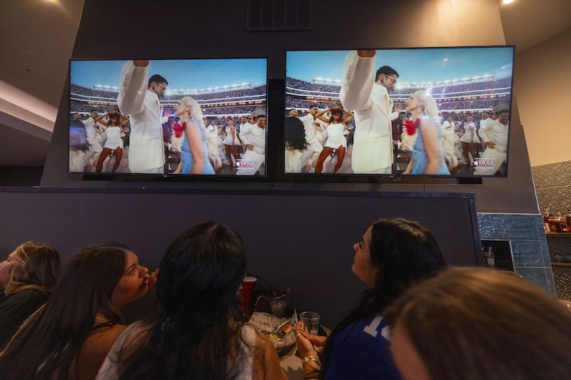 Viewers watch the Super Bowl LX Halftime show on television screens at a bar in Los Angeles, California, US, on Sunday, Feb. 8, 2026. Super Bowl viewers can expect to see more ads from the technology, pharmaceutical and wellness industries as they watch the Seattle Seahawks take on the New England Patriots during the broadcast on NBC. Photographer: Jill Connelly/Bloomberg Viewers watch the Super Bowl LX Halftime show on television screens at a bar in Los Angeles, California, US, on Sunday, Feb. 8, 2026. Super Bowl viewers can expect to see more ads from the technology, pharmaceutical and wellness industries as they watch the Seattle Seahawks take on the New England Patriots during the broadcast on NBC. Photographer: Jill Connelly/Bloomberg