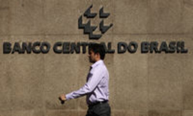 A pedestrian walks past the Central Bank of Brazil building in Brasilia, Brazil. A pedestrian walks past the Central Bank of Brazil building in Brasilia, Brazil.