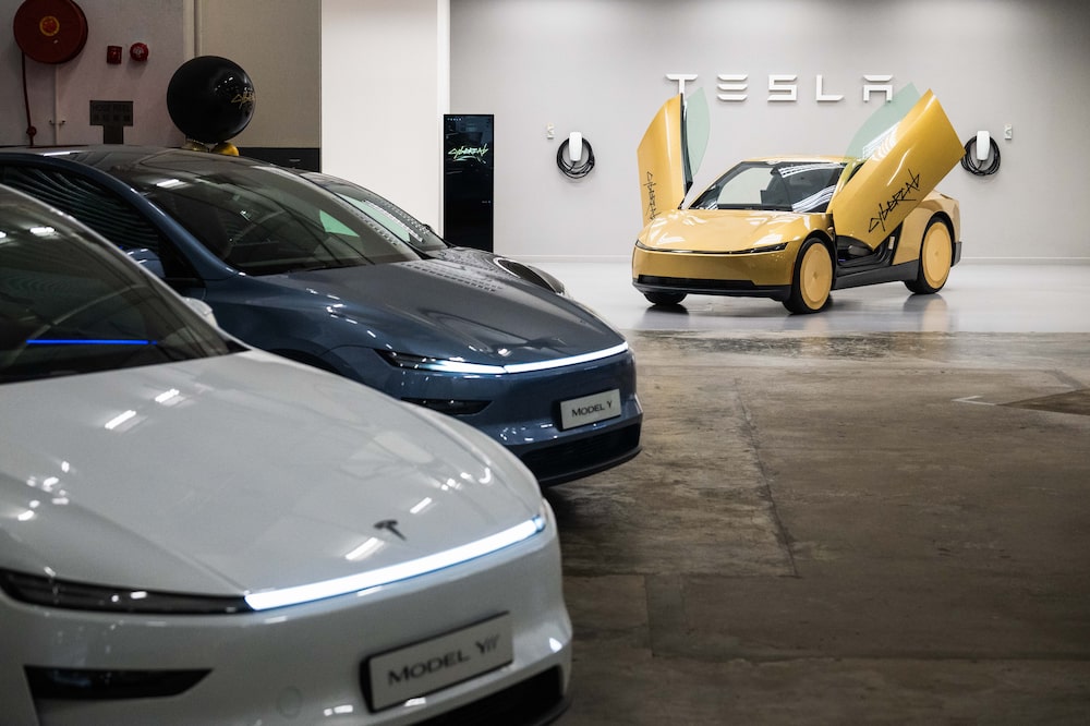 A Tesla Inc. Cybercab driverless car, right, displayed alongside Model Y vehicles during a preview at the company's delivery center in Hong Kong, China, on Monday, Sept. 7, 2026. The Cybercab, which has been in testing in multiple US cities in recent months, is seen as a key piece of Tesla's plan to evolve beyond a maker of electric vehicles into a pioneer of artificial intelligence products. Photographer: Billy H.C. Kwok/Bloomberg A Tesla Inc. Cybercab driverless car, right, displayed alongside Model Y vehicles during a preview at the company's delivery center in Hong Kong, China, on Monday, Sept. 7, 2026. The Cybercab, which has been in testing in multiple US cities in recent months, is seen as a key piece of Tesla's plan to evolve beyond a maker of electric vehicles into a pioneer of artificial intelligence products. Photographer: Billy H.C. Kwok/Bloomberg