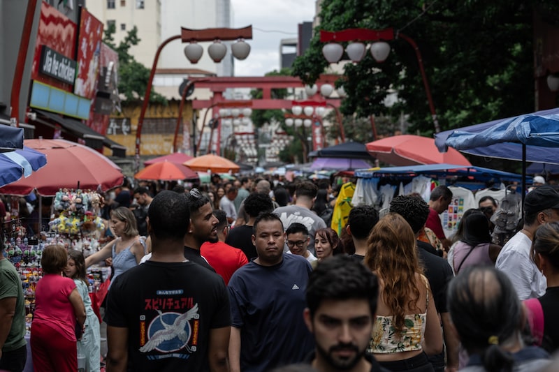 Shoppers and tourists at a street market in the Liberdade neighborhood of Sao Paulo. Shoppers and tourists at a street market in the Liberdade neighborhood of Sao Paulo.