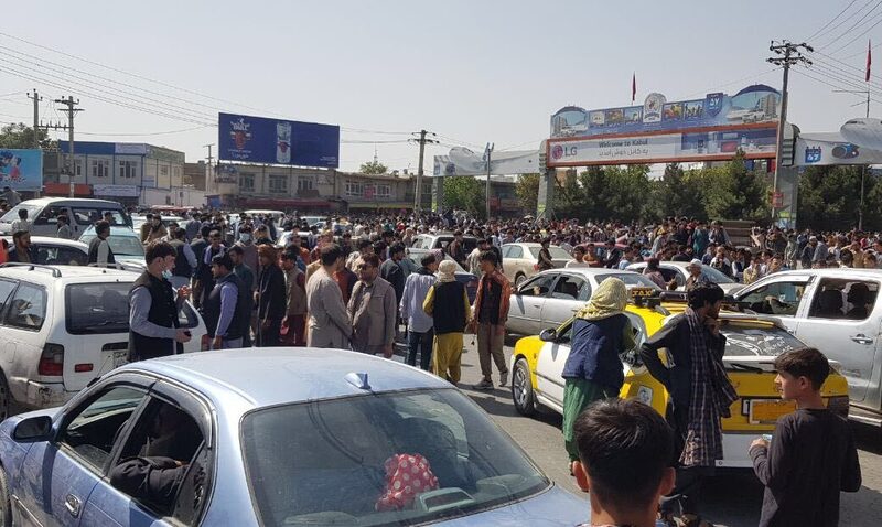 Afghans crowd at the tarmac of the Kabul airport on August 16, 2021. Photographer: Getty Images Agency/Anadolu Afghans crowd at the tarmac of the Kabul airport on August 16, 2021. Photographer: Getty Images Agency/Anadolu