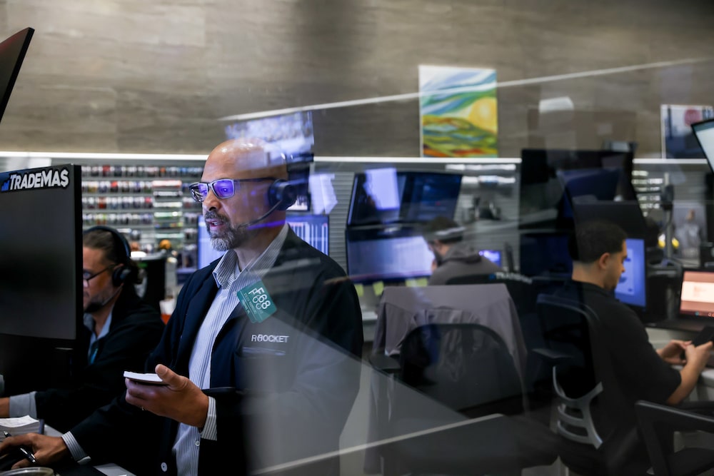 Traders work on the floor of the American Stock Exchange (AMEX) at the New York Stock Exchange (NYSE) in New York, US, on Monday, July 6, 2026. US President Donald Trump rang the opening bell for the New York Stock Exchange and the Nasdaq from the Oval Office on Monday, a celebratory event to mark the launch of Trump Accounts, a new investment vehicle for children. Photographer: Michael Nagle/Bloomberg Traders work on the floor of the American Stock Exchange (AMEX) at the New York Stock Exchange (NYSE) in New York, US, on Monday, July 6, 2026. US President Donald Trump rang the opening bell for the New York Stock Exchange and the Nasdaq from the Oval Office on Monday, a celebratory event to mark the launch of Trump Accounts, a new investment vehicle for children. Photographer: Michael Nagle/Bloomberg