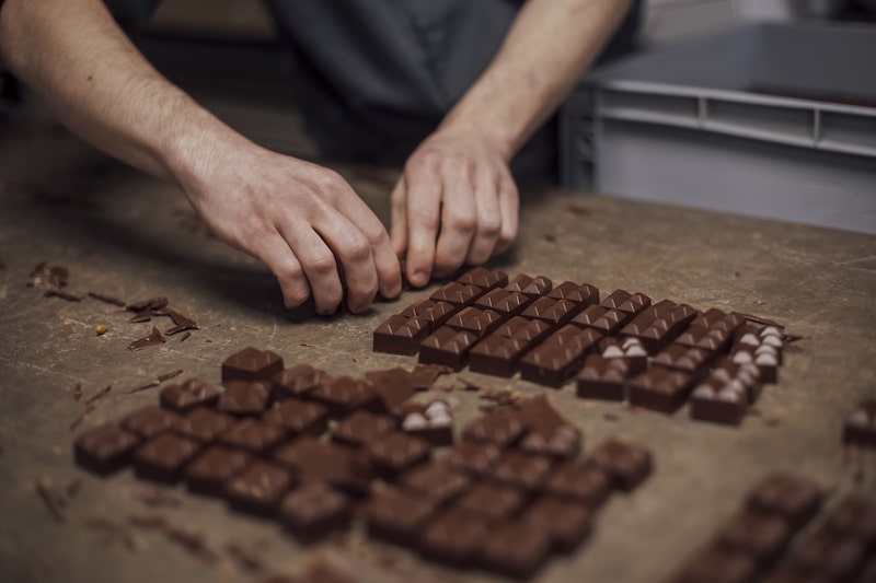 An employee prepares handmade chocolates for packaging at Alain Ducasse's chocolate factory in Paris, France, on Monday, April 22, 2024. Cocoa production is expected to recover next year as the impact of El Nino fades, Marijn Moesbergen, sourcing lead at Cargill, said at the World Cocoa Conference in Brussels. Photographer: Cyril Marcilhacy/Bloomberg An employee prepares handmade chocolates for packaging at Alain Ducasse's chocolate factory in Paris, France, on Monday, April 22, 2024. Cocoa production is expected to recover next year as the impact of El Nino fades, Marijn Moesbergen, sourcing lead at Cargill, said at the World Cocoa Conference in Brussels. Photographer: Cyril Marcilhacy/Bloomberg