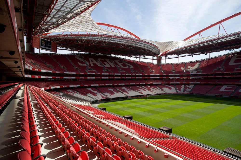 Benfica's Luz stadium, named Estadio do Sport Lisboa e Benfica, in Lisbon, Portugal, on Thursday, April 27, 2017. The stadium opened in 2003 with a capacity of 64,400 seats. In the Euro 2004 hosted the final between Greece and Portugal and in 2014 hosted the Champions League final between Real Madrid and Atletico Madrid. Photographer: Paulo Duarte/Bloomberg Benfica's Luz stadium, named Estadio do Sport Lisboa e Benfica, in Lisbon, Portugal, on Thursday, April 27, 2017. The stadium opened in 2003 with a capacity of 64,400 seats. In the Euro 2004 hosted the final between Greece and Portugal and in 2014 hosted the Champions League final between Real Madrid and Atletico Madrid. Photographer: Paulo Duarte/Bloomberg