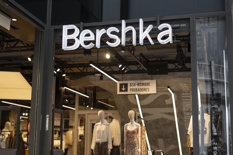 Signage outside a Bershka fashion store in A Coruna, Spain, on Wednesday, March 12, 2025. Although faring better than many of its rivals, the world’s largest listed clothing retailer showed it’s beginning to feel the impact of cuts in consumer spending as large swathes of the global economy slow down. Photographer: Brais Lorenzo/Bloomberg Signage outside a Bershka fashion store in A Coruna, Spain, on Wednesday, March 12, 2025. Although faring better than many of its rivals, the world’s largest listed clothing retailer showed it’s beginning to feel the impact of cuts in consumer spending as large swathes of the global economy slow down. Photographer: Brais Lorenzo/Bloomberg