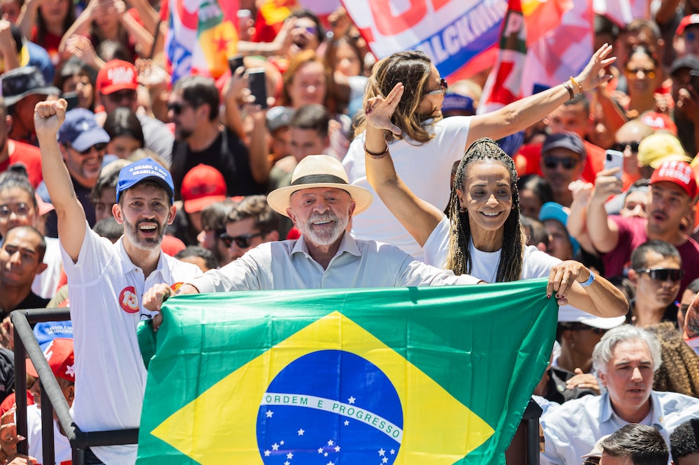 Luiz Inacio Lula da Silva, Brazil's president, center, Leandro Grass, candidate for governor of Brazil's Federal District, left, and Dora Gomes, candidate for vice governor of Brazil's Federal District, during a campaign rally in Brasilia, Brazil, on Friday, Oct. 9, 2026. Lula has said he plans to target the roughly 33 million voters who didnt cast a ballot in the first round, urging them to turn out for the Oct. 25 runoff in a flurry of social media posts. Photographer: Arthur Menescal/Bloomberg Luiz Inacio Lula da Silva, Brazil's president, center, Leandro Grass, candidate for governor of Brazil's Federal District, left, and Dora Gomes, candidate for vice governor of Brazil's Federal District, during a campaign rally in Brasilia, Brazil, on Friday, Oct. 9, 2026. Lula has said he plans to target the roughly 33 million voters who didnt cast a ballot in the first round, urging them to turn out for the Oct. 25 runoff in a flurry of social media posts. Photographer: Arthur Menescal/Bloomberg