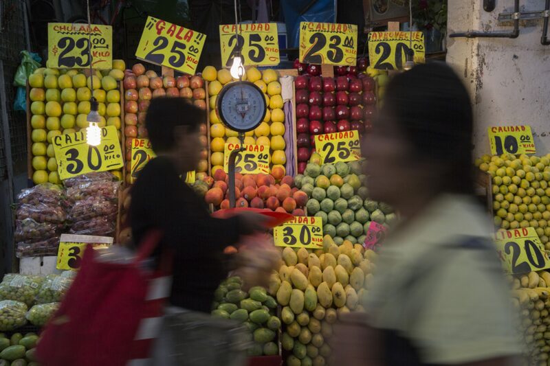 Shoppers walk past a fruit stand at the Central de Abasto market in the Iztapalapa neighborhood of Mexico City, Mexico, on Tuesday, July 28, 2015. Just as Mexico's consumer sector begins to emerge from the doldrums of the 2009 recession, a new government report suggests the recovery's foundation is on shaky ground. Photographer: Susana Gonzalez/Bloomberg Shoppers walk past a fruit stand at the Central de Abasto market in the Iztapalapa neighborhood of Mexico City, Mexico, on Tuesday, July 28, 2015. Just as Mexico's consumer sector begins to emerge from the doldrums of the 2009 recession, a new government report suggests the recovery's foundation is on shaky ground. Photographer: Susana Gonzalez/Bloomberg