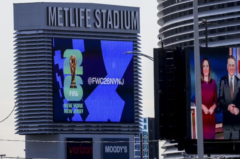 FIFA World Cup 2026 signage at MetLife Stadium, which will host eight FIFA World Cup 2026 games, in East Rutherford, New Jersey, US, on Tuesday, April 21, 2026. Public transport systems are jacking up fares, with New Jersey Transit raising train fares for World Cup matches to $150 round trip, and special shuttle bus tickets running $80, while some stadiums will have limited public service or none at all. Photographer: Michael Nagle/Bloomberg FIFA World Cup 2026 signage at MetLife Stadium, which will host eight FIFA World Cup 2026 games, in East Rutherford, New Jersey, US, on Tuesday, April 21, 2026. Public transport systems are jacking up fares, with New Jersey Transit raising train fares for World Cup matches to $150 round trip, and special shuttle bus tickets running $80, while some stadiums will have limited public service or none at all. Photographer: Michael Nagle/Bloomberg