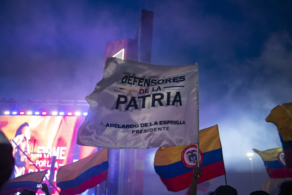 Flags held by supporters of Abelardo de la Espriella, presidential candidate for the Defenders of the Homeland party, not pictured, during a runoff election night rally at the party headquarters in Barranquilla, Colombia, on Sunday, June 21, 2026. Colombia elected conservative lawyer De la Espriella president on Sunday, heralding a swing back to business-friendly and pro-US policies after four years of leftist rule. Photographer: Carlos Parra Rios/Bloomberg Flags held by supporters of Abelardo de la Espriella, presidential candidate for the Defenders of the Homeland party, not pictured, during a runoff election night rally at the party headquarters in Barranquilla, Colombia, on Sunday, June 21, 2026. Colombia elected conservative lawyer De la Espriella president on Sunday, heralding a swing back to business-friendly and pro-US policies after four years of leftist rule. Photographer: Carlos Parra Rios/Bloomberg